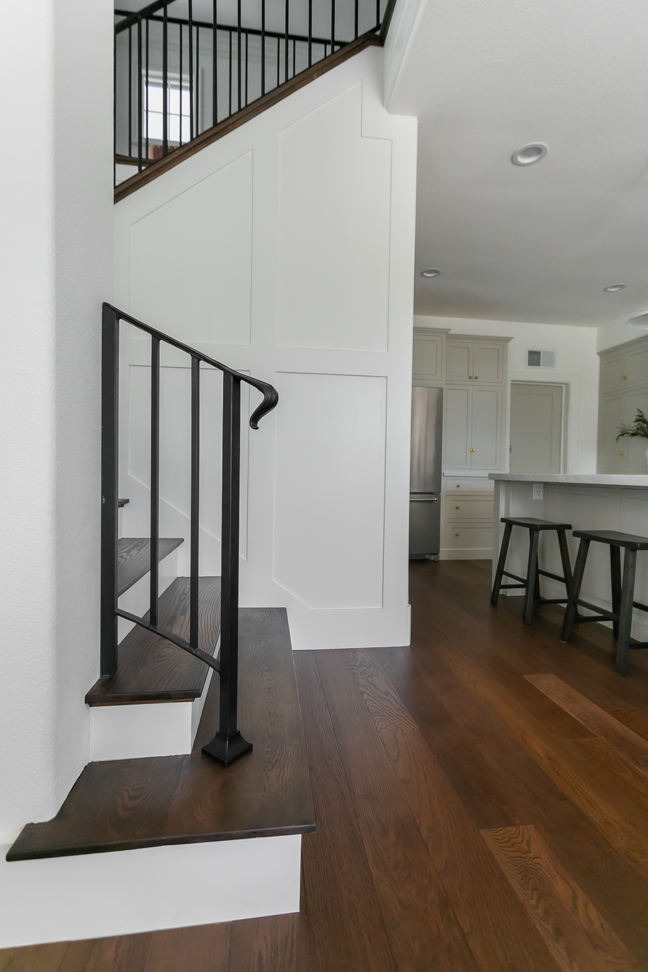 Custom home staircase and open-plan kitchen addition by J. Arthur Custom Homes in Texas Hill Country